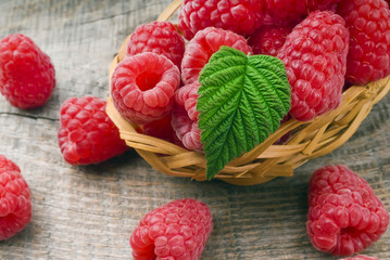 Heap of raspberry on a wooden background