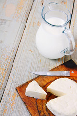 Dairy products on wooden background.
