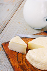 Dairy products on wooden background.