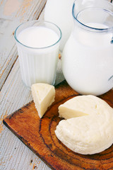 Dairy products on wooden background.