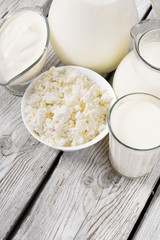 Dairy products on wooden background.