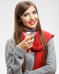 Young girl drink alcohol with glass. Smiling model.