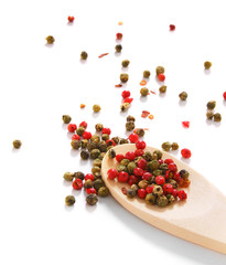 pepper on wooden spoon