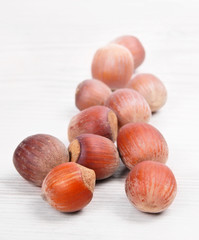 Nuts on wooden board.