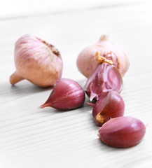 Garlic on wooden board.