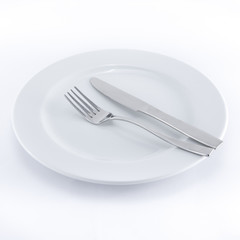 White plate, knife and fork