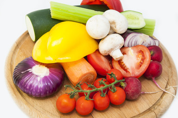 fresh vegetables and mushrooms on a wooden table