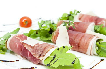 meat rolls with meat and greens on a table in a restaurant
