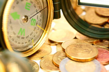 Compasses and gold coins.