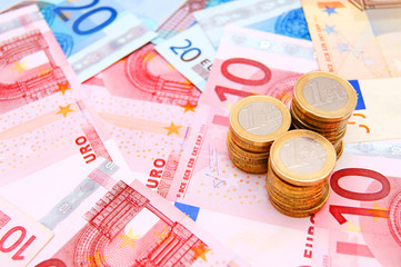 Coins against from banknotes