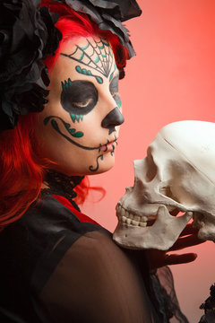 beautiful model with halloween make up sugar skull.,