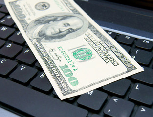 Denomination (dollar) on the laptop.