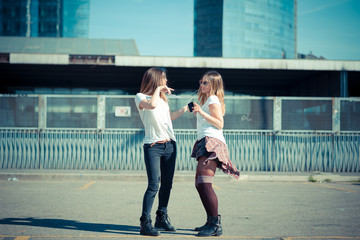 two beautiful young women dancing