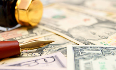 Pen and ink on dollars.