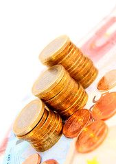 Heap of coins for euro banknotes.