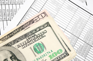 Money (dollars) on the documents.