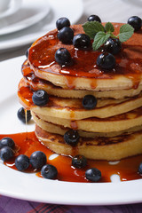 American Pancake with fresh blueberries and maple syrup