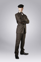 Man posing in retro style suit of twenties