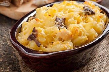 Macaroni with cheese, chicken and mushrooms baked in the oven
