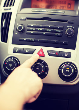 Man Pressing Car Hazard Warning Button