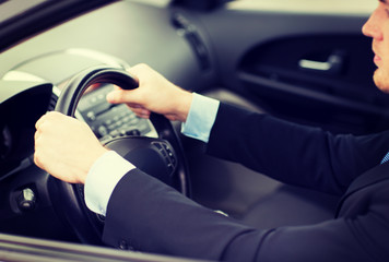businessman driving a car