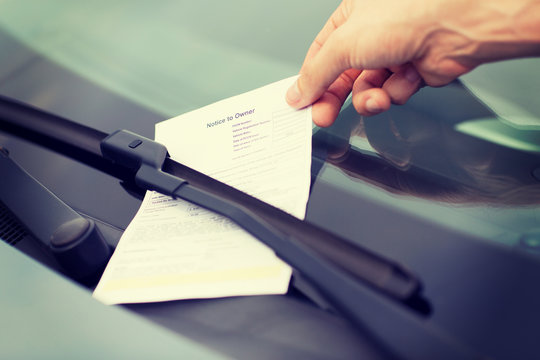 parking ticket on car windscreen