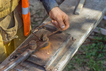 Worker bending spacers for the rebars in a concrete post