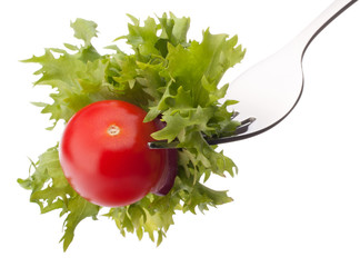 Fresh salad and cherry tomato on fork isolated on white backgrou