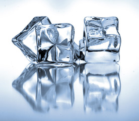 Ice cubes on blue background