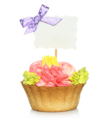 Cupcake with blank card on white background.