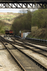 Obraz premium Iron railway tracks converging on the North Yorkshire Moors Rail