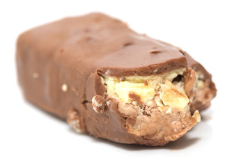 bitten off chocolate on white background
