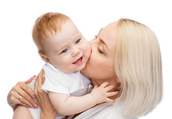 happy mother kissing smiling baby