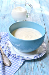 Semolina porridge on the wooden table.
