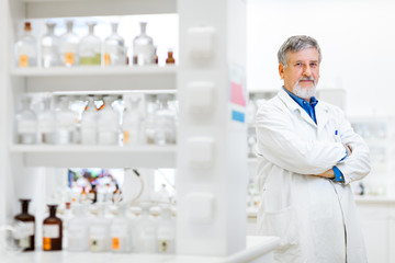 Senior male researcher carrying out scientific research in a lab