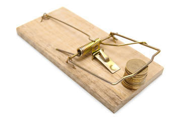 Coins in a mousetrap. On a white background.