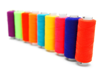 Multi-coloured threads. On a white background.