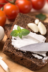 Goat cheese on rye bread closeup