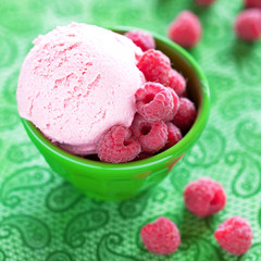 Ice cream with fresh raspberries, selective focus