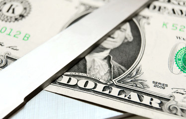 Money and scissors.