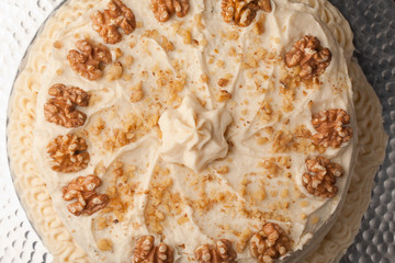 Maple Walnut Cinnamon Cake on silver platter - top view