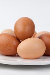 Vertical shot of platter of farm fresh brown eggs