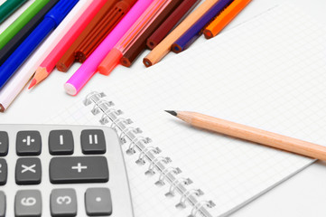 Notebook, pencils, the calculator.