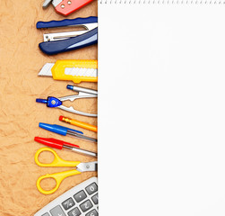 school accessories on rumpled paper.