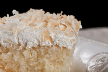 Coconut cream cake - macro shot close up of toasted coconut topping
