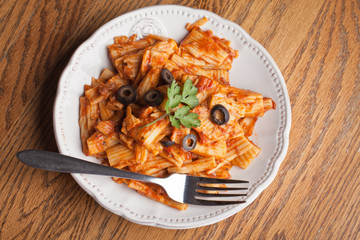 Top view of plate of baked rigatoni pasta