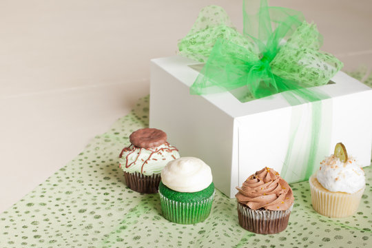 St. Patrick's Day gift box with room for writing Coconut Key Lime Cupcake, Pot of Gold Chocolate Caramel Cupcake, Irish Mint Chocolate Cupcake, and Green Velvet Cupcake 