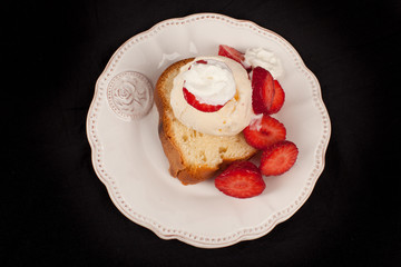 Strawberry shortcake top view on a black background