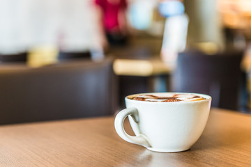 Coffee cup in coffee shop interior