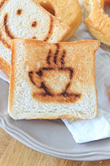 Coffee burn mark on toasted bread